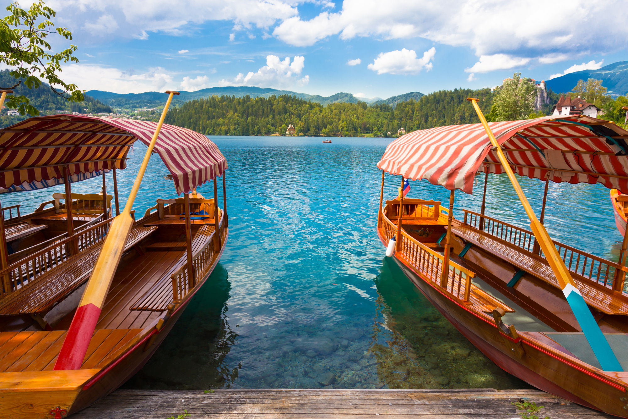 Traditional wooden boats on picture perfect lake Bled, Slovenia.
