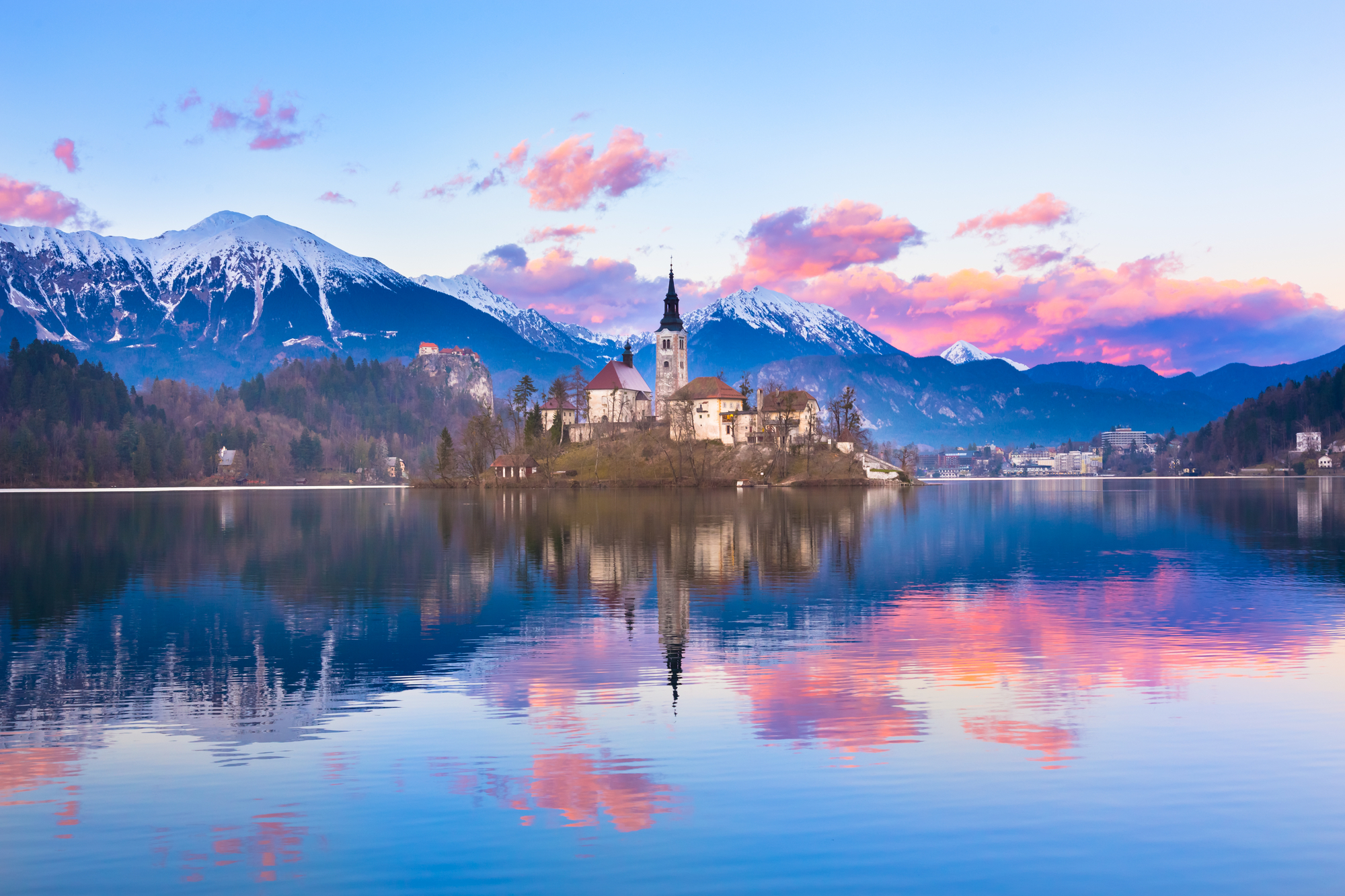 Sunset view of Julian Alps, Lake Bled with St. Marys Church of the Assumption on the small island. Bled, Slovenia, Europe.